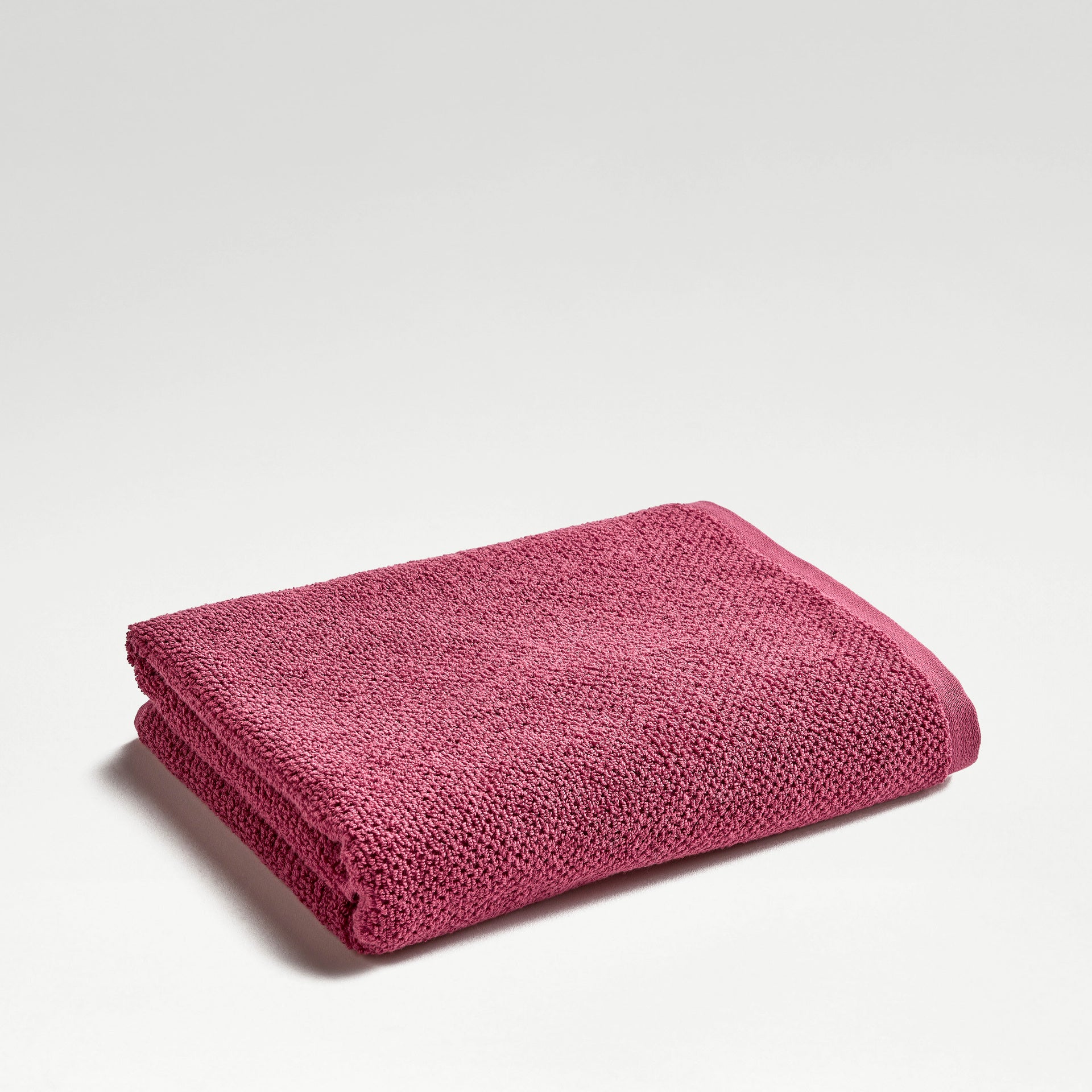 A combed cotton bath towel at 600gsm with a textured border.