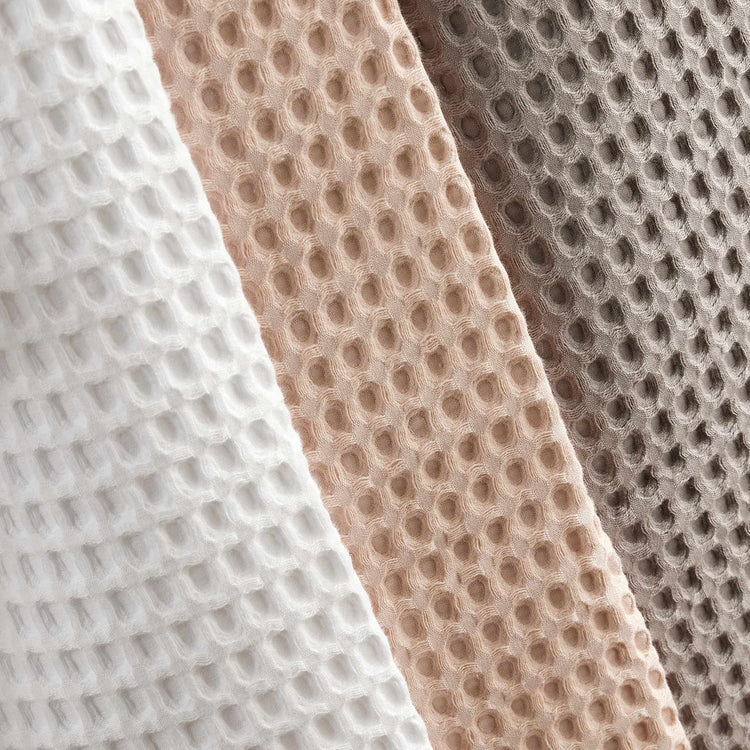 A group of waffle robes displayed attractively, highlighting their luxury and appeal